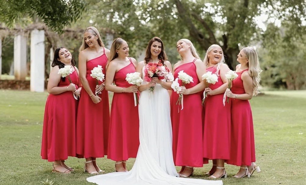 Bride and pink bridesmaid dresses client photo